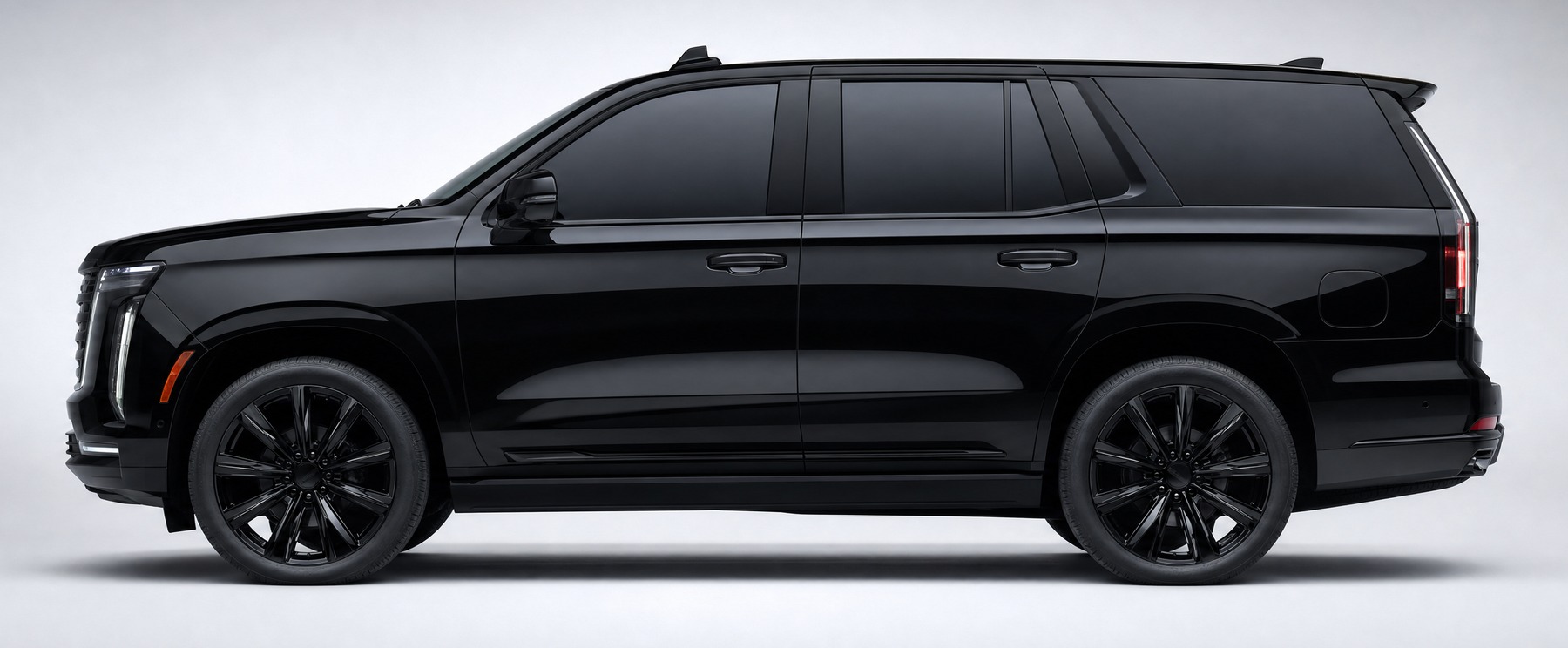 Black Cadillac Escalade in side profile with the sixteen ad spots marked